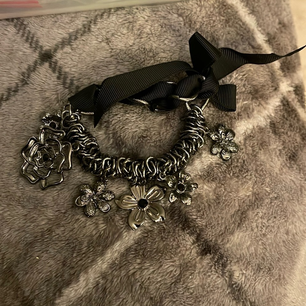 Black ribbon and metal bracelet
